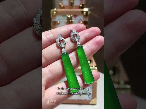 Two green jadeite cabochon earrings shown in Feiyuehui Studios EP11, a film about jadeite certificates and quality assessment