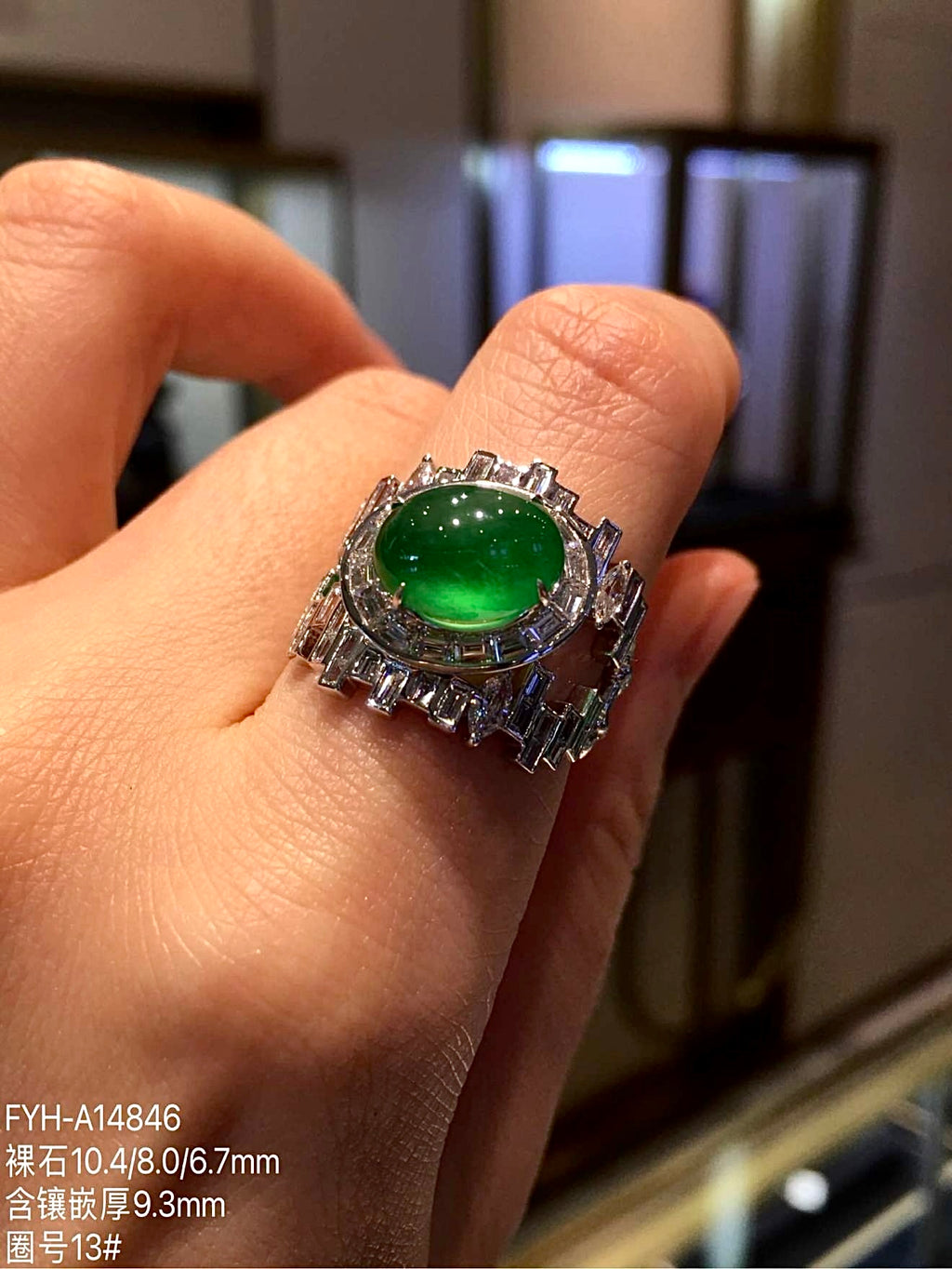 Yang green jadeite and diamond ring worn on a hand for scale