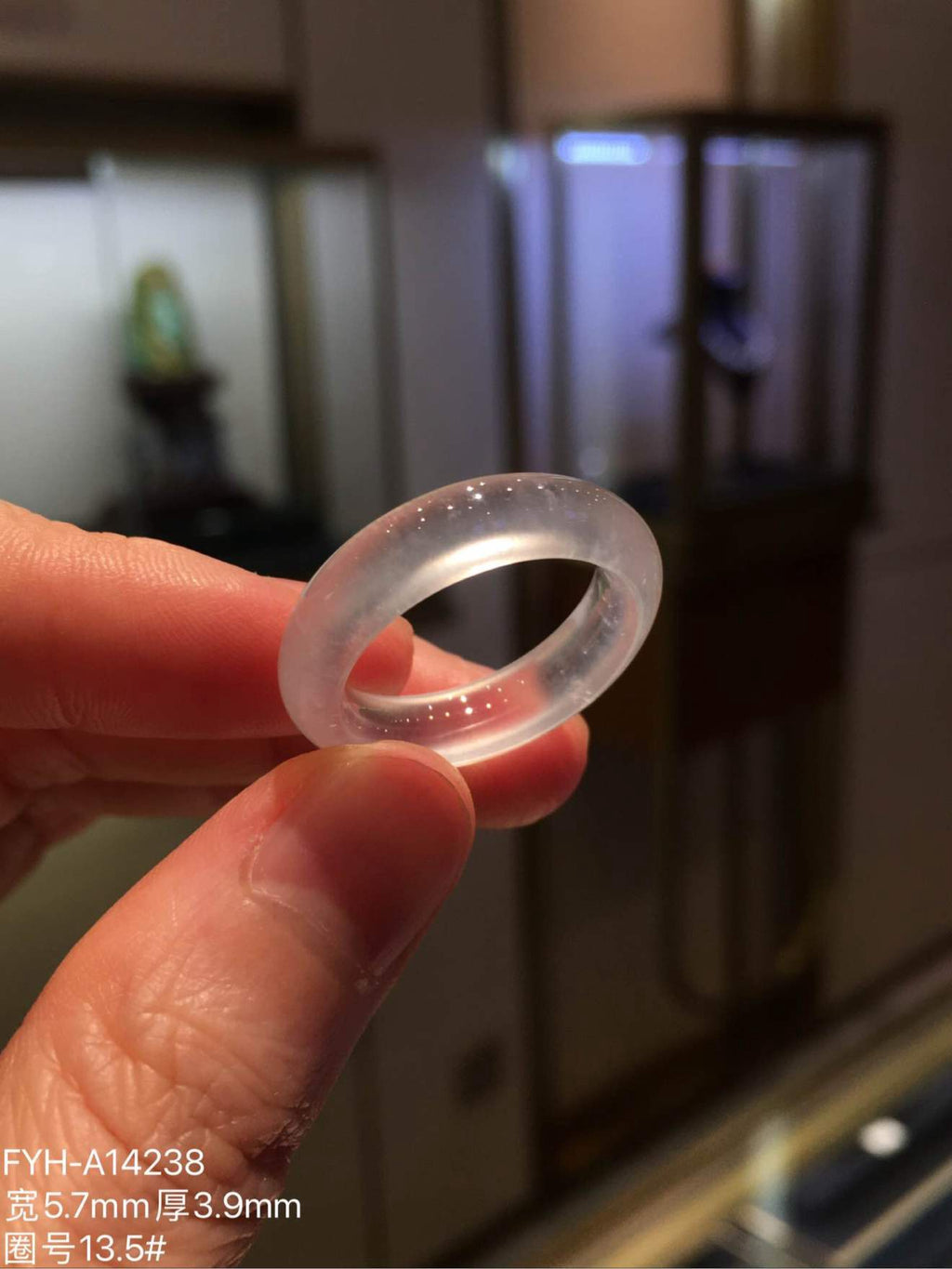 Angled view of the translucent jadeite ring and its inner opening