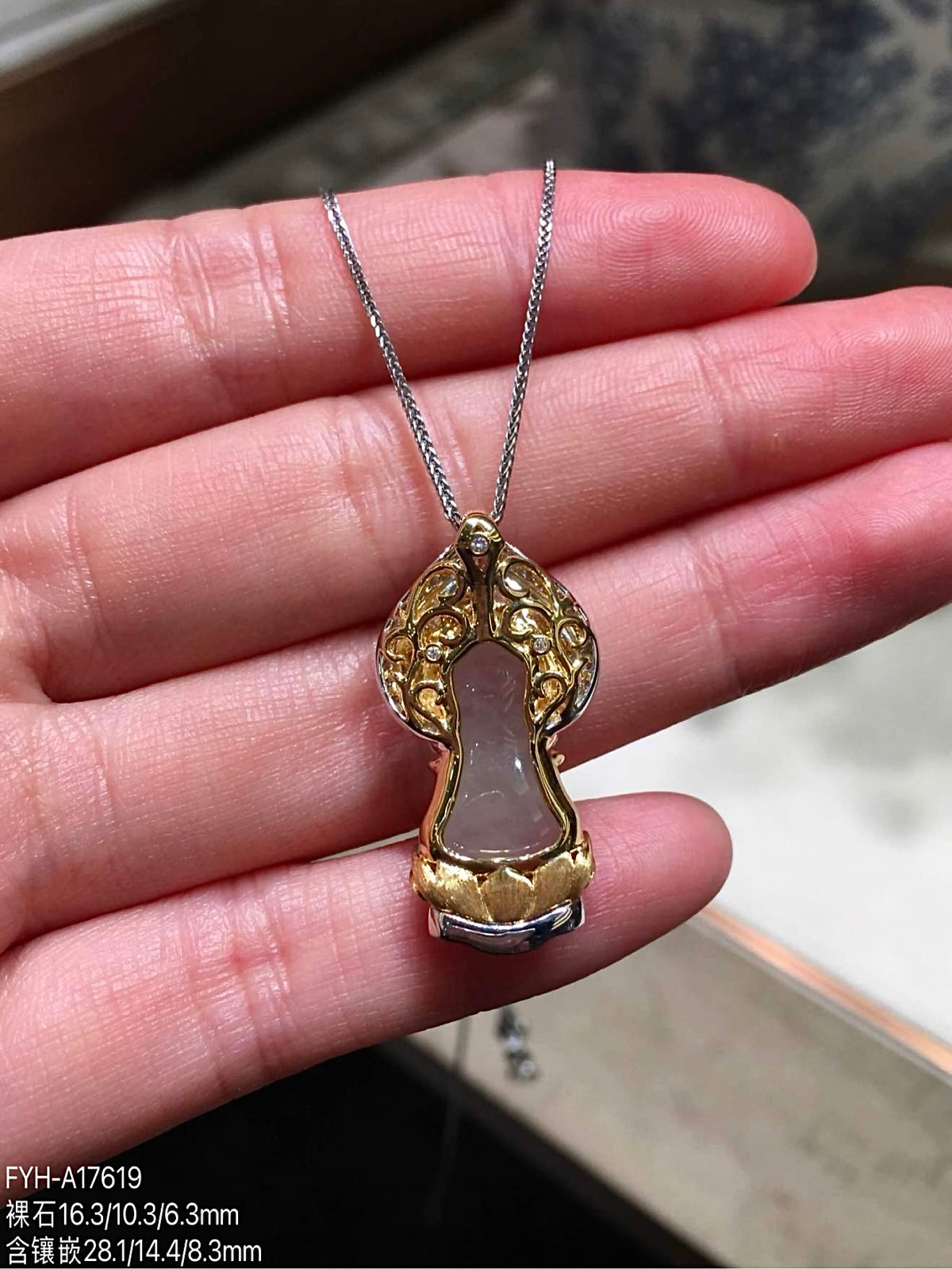 Back view of the 18K gold setting behind the jadeite Baby Buddha pendant