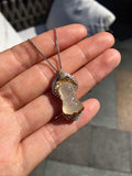 High-ice jadeite Baby Buddha pendant in 18K gold and diamonds, angled front view
