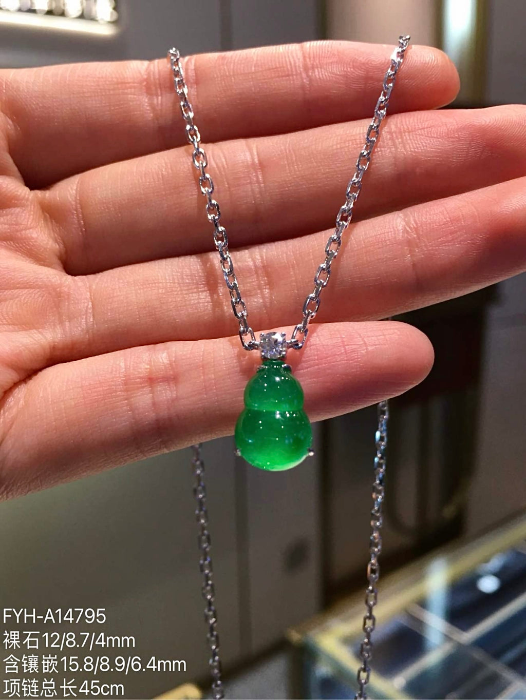 Front view of vivid green jadeite gourd necklace with 45 cm chain