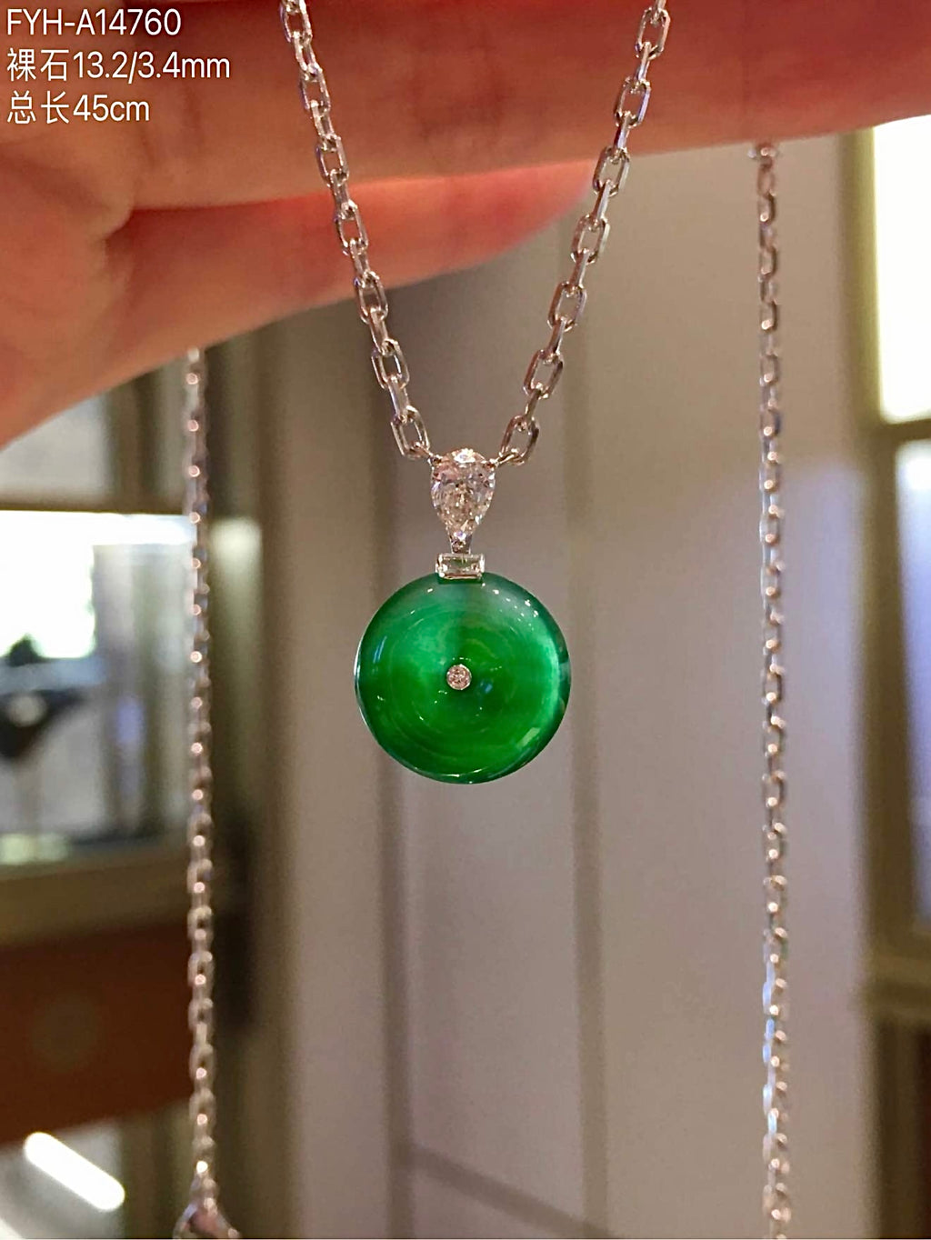 Closer front view showing varied floating green across the jadeite disc