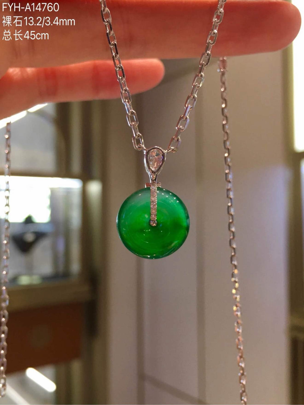 Reverse view showing the 18K gold and diamond pendant setting