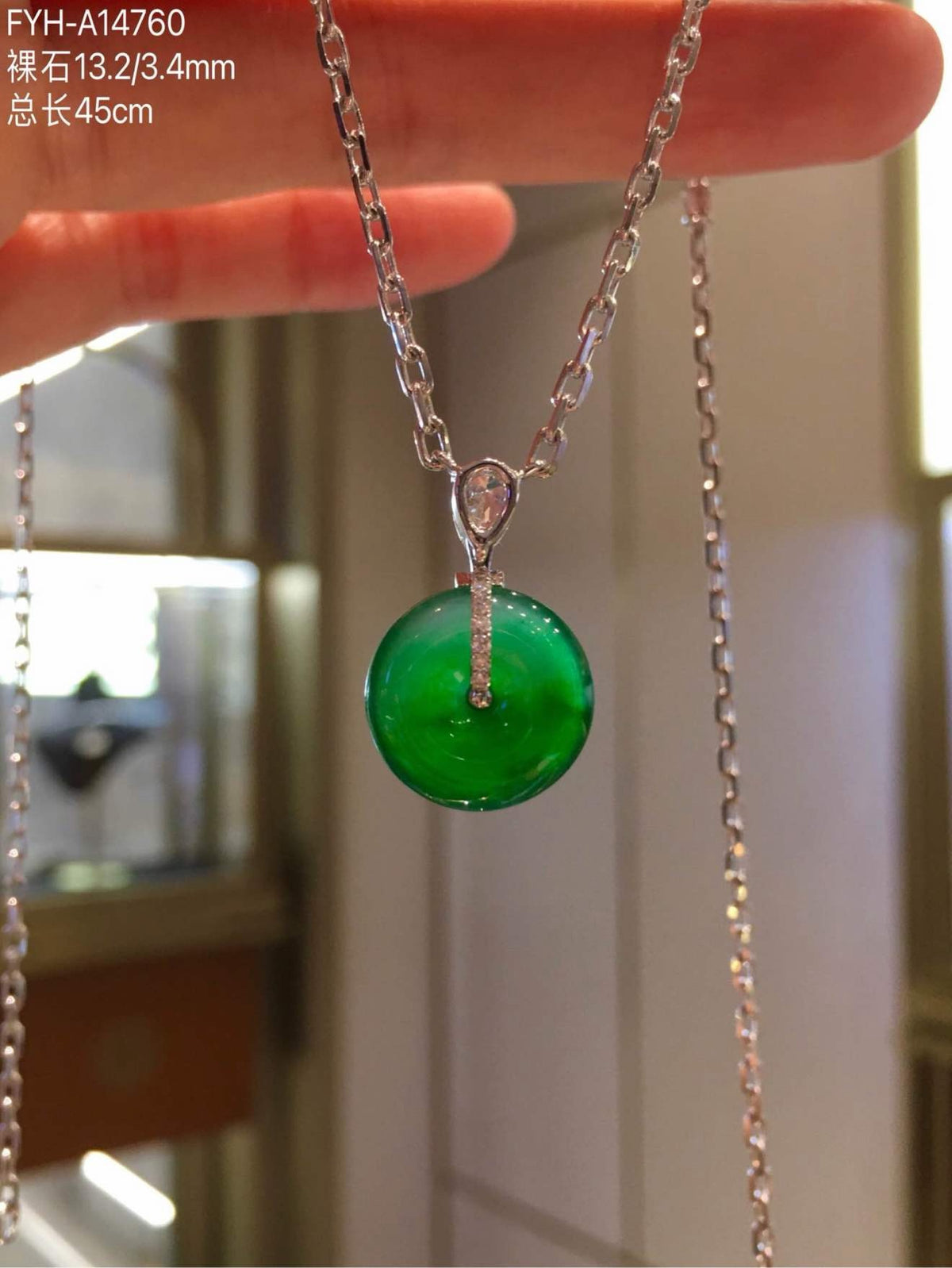 Reverse view showing the 18K gold and diamond pendant setting