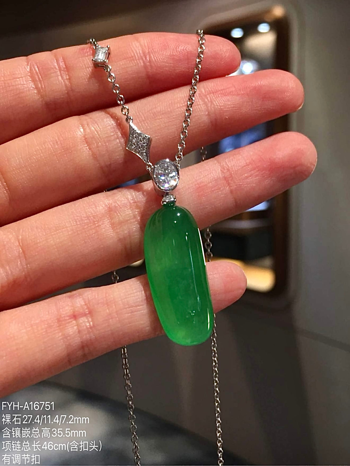 Close front angle of glass-type green jadeite Fu Gua pendant and included chain