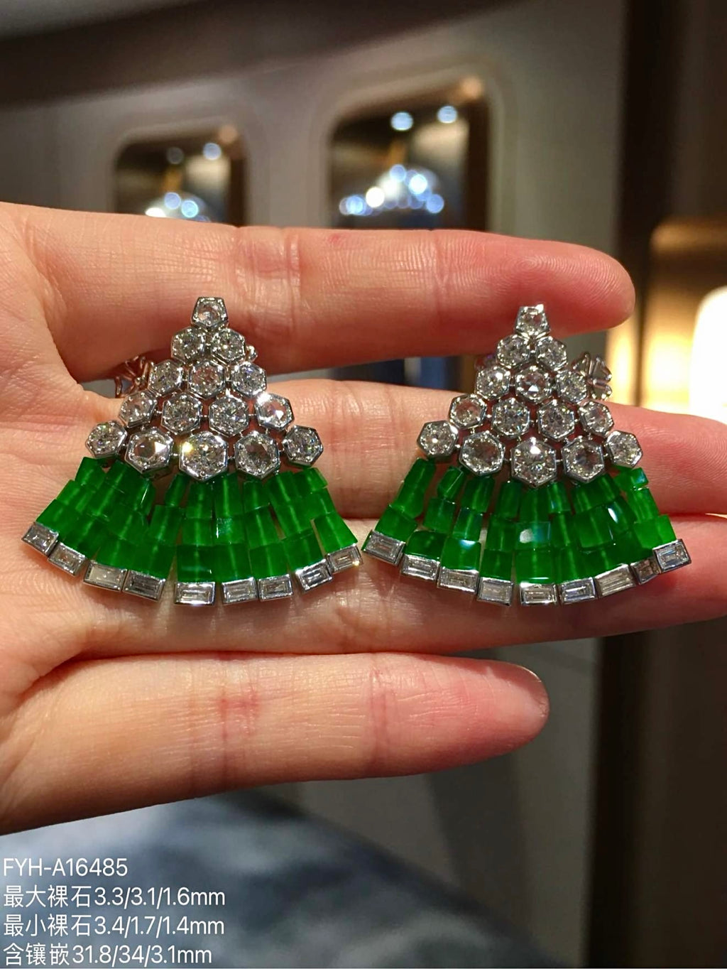 Front close-up of matching jadeite and diamond triangular earrings