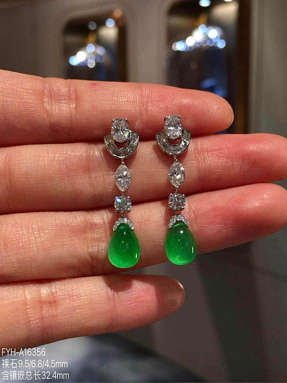 Pair of vivid green jadeite teardrop earrings with 18K gold and diamond accents