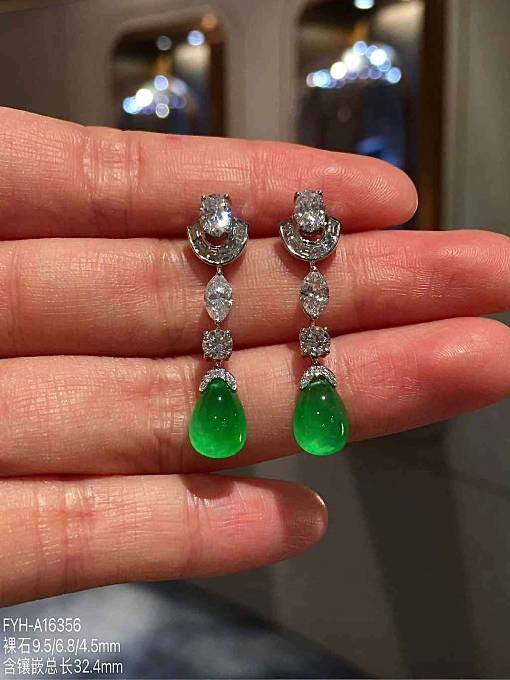 Front close-up of matching glass-type green jadeite and diamond drop earrings