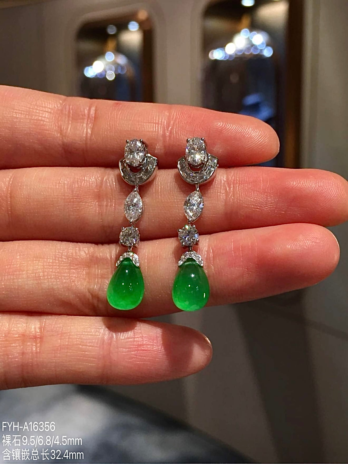 Front view of paired vivid green jadeite teardrop earrings
