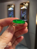 Front view of glass-type imperial green jadeite bar ring in 18K gold and diamonds