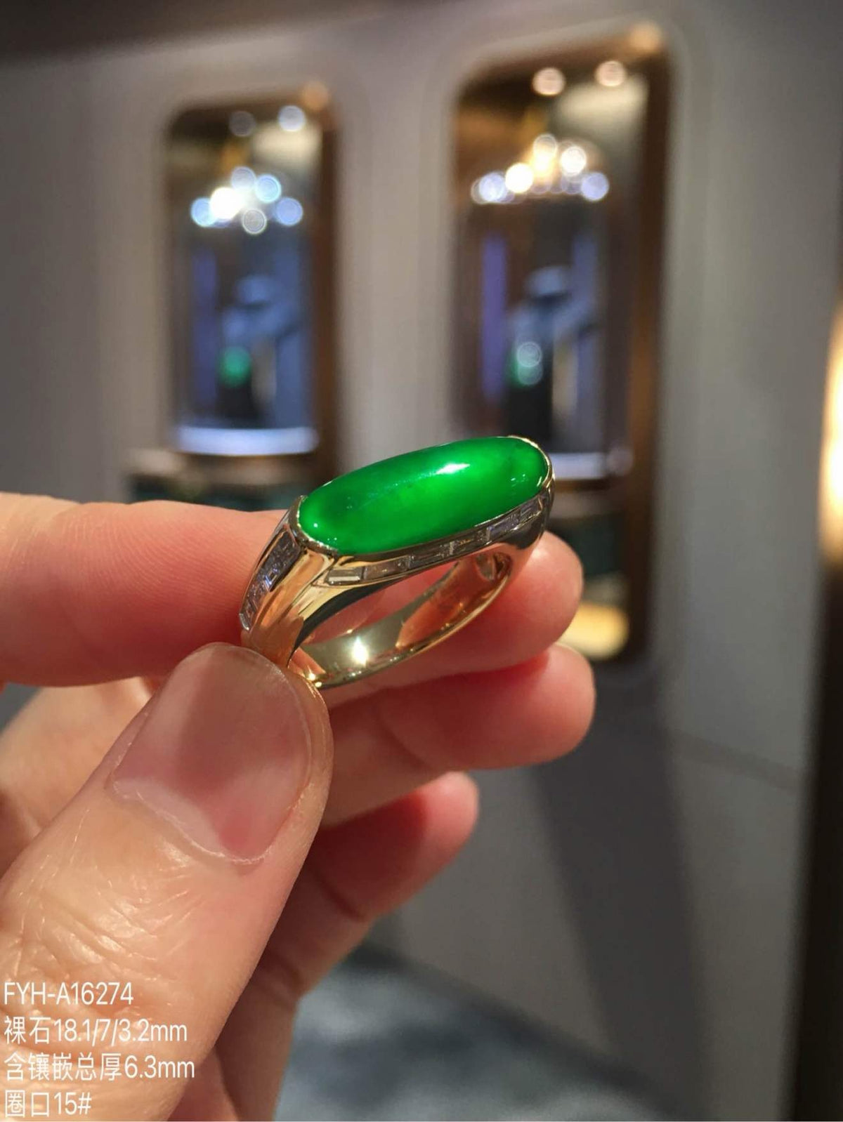 Three-quarter view of the imperial green jadeite ring with diamond accents