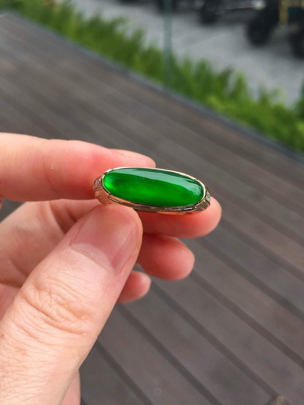 Natural-light view of the imperial green jadeite bar ring