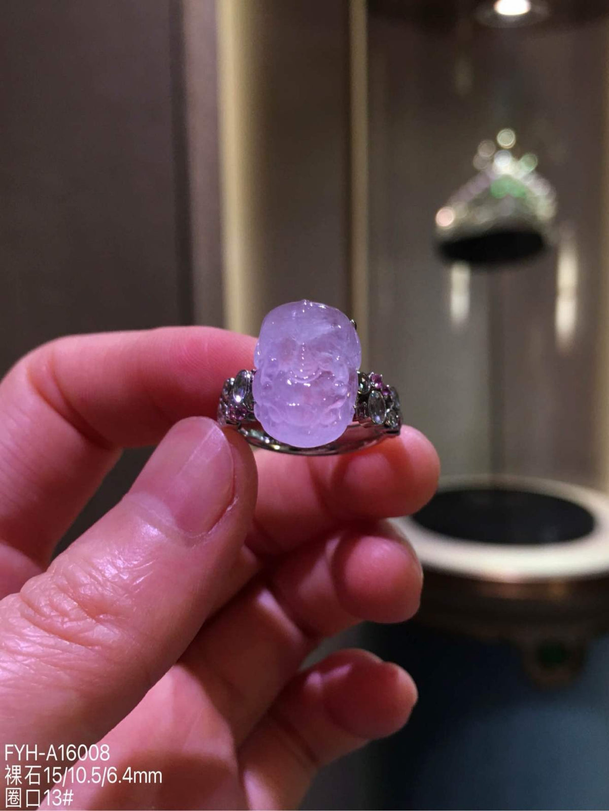 Front view of FYH-A16008, a high-icy lavender jadeite Pixiu ring set in 18K gold with diamonds