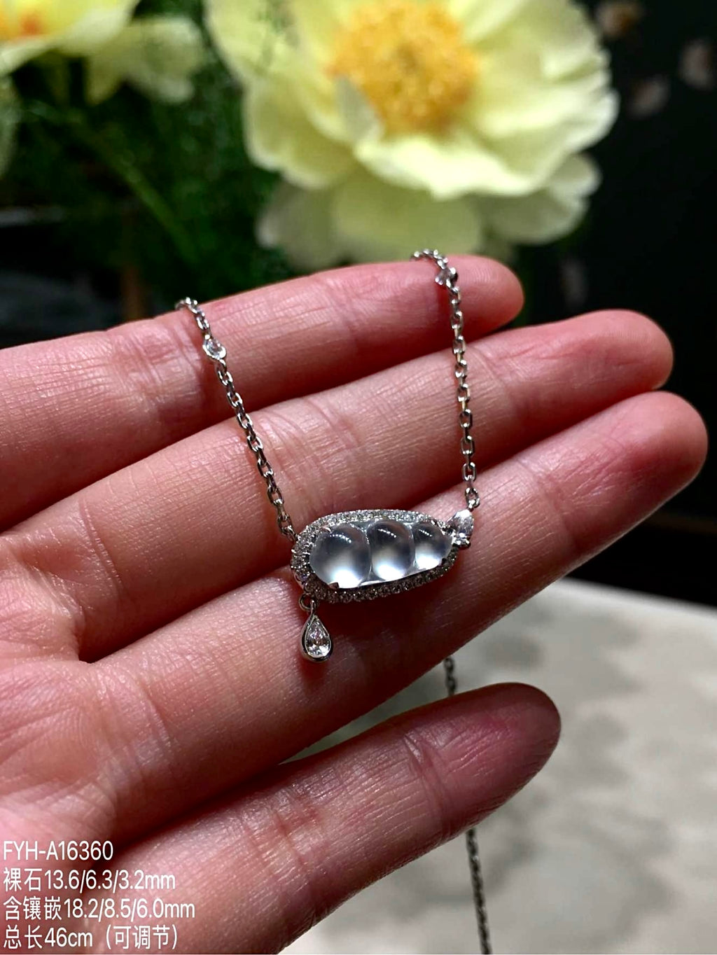 A finely carved jadeite Fu Dou necklace, set in 18K gold and diamonds — a quiet Eastern symbol of blessing, worn close to the heart.