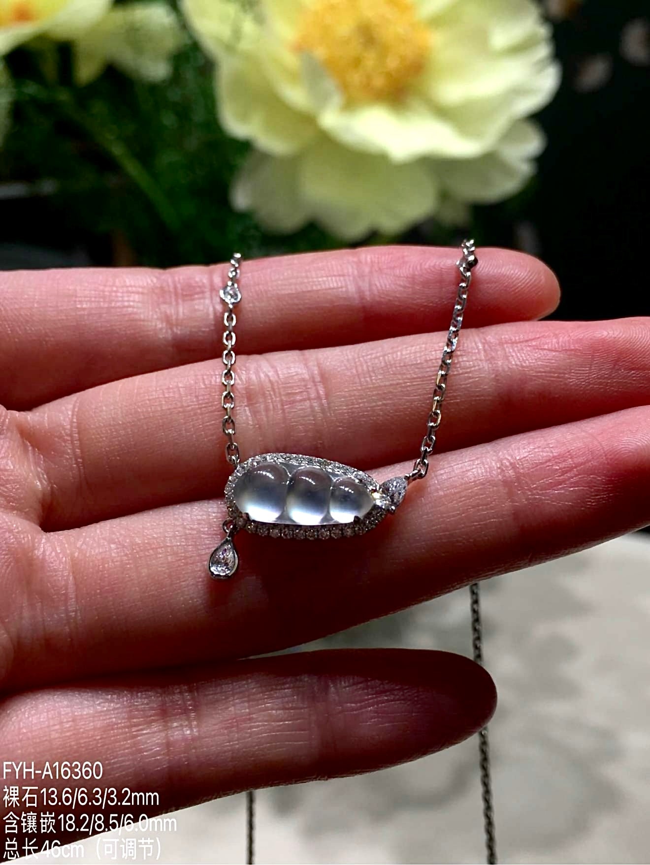 A finely carved jadeite Fu Dou necklace, set in 18K gold and diamonds — a quiet Eastern symbol of blessing, worn close to the heart.