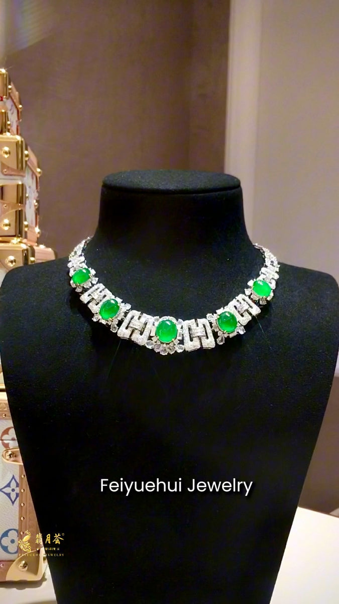 Feiyuehui High Jewelry imperial green jadeite necklace displayed on a black bust
